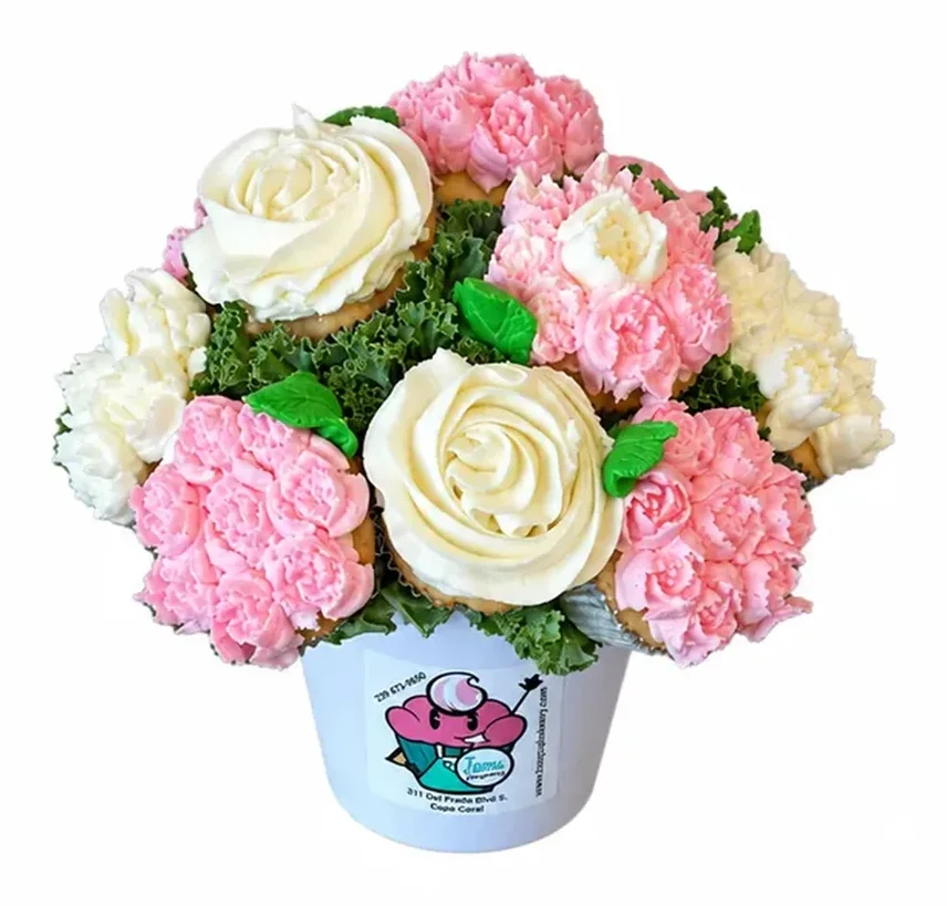 Cupcake bouquet piped as pink and white flowers in a Tamu cup