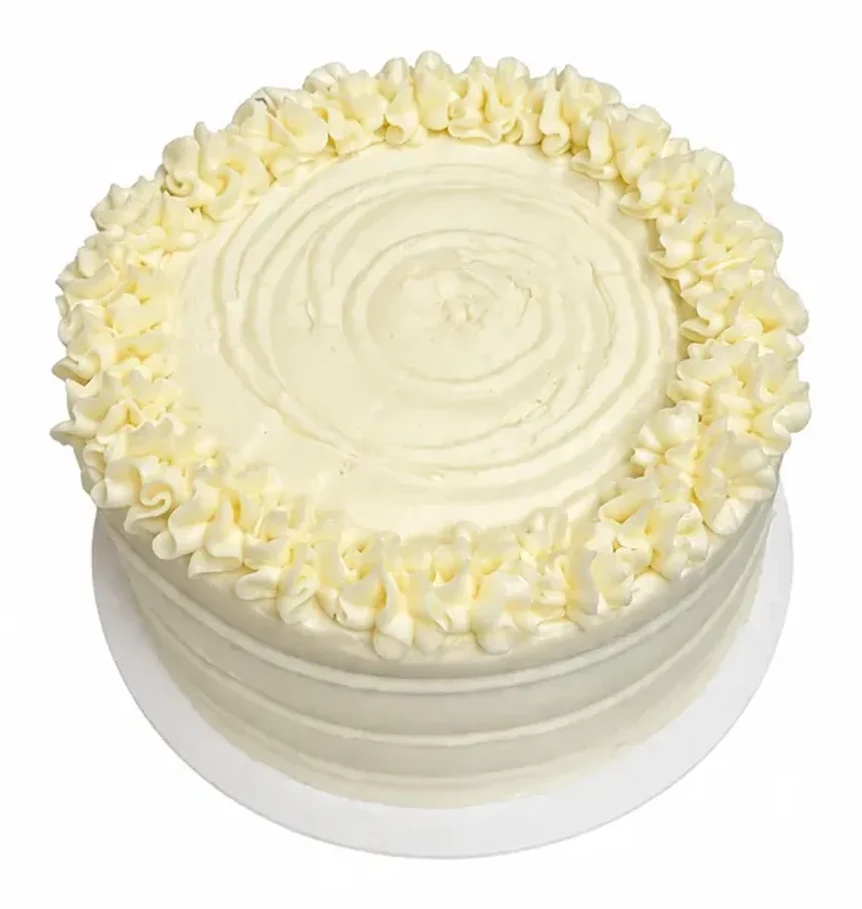 Round cake finished in white frosting with a piped border